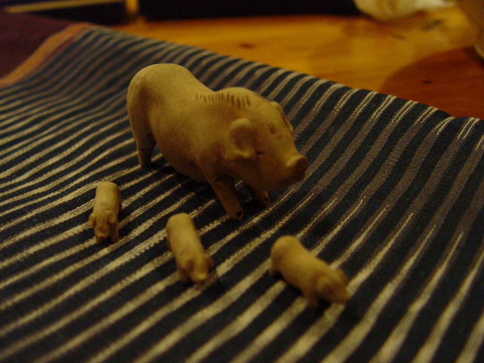 Hand carved, late 19th century,
                                    early 20th Mother pig and piglets