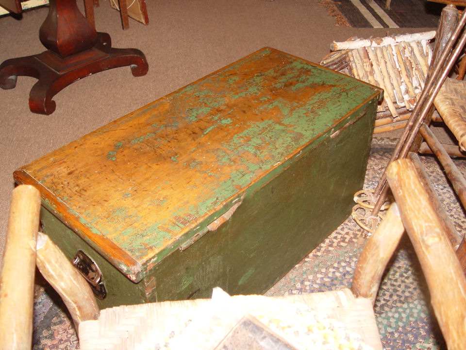 Great painted
              primitive trunk with original green paint. Dovetailed
              construction.