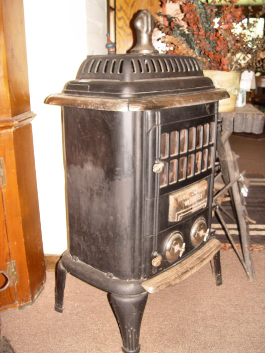 Original Vintage Antique black and chrome parlor
                wood stove