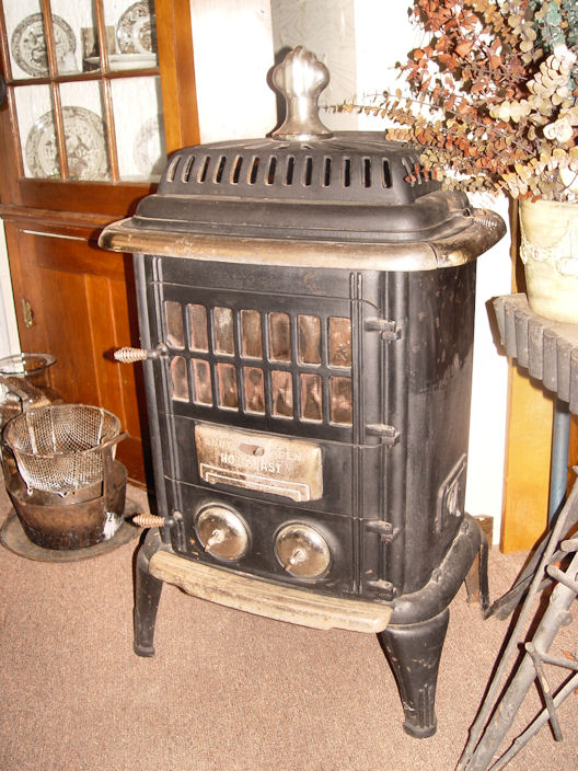 Original Vintage Antique black and chrome
                          parlor wood stove
