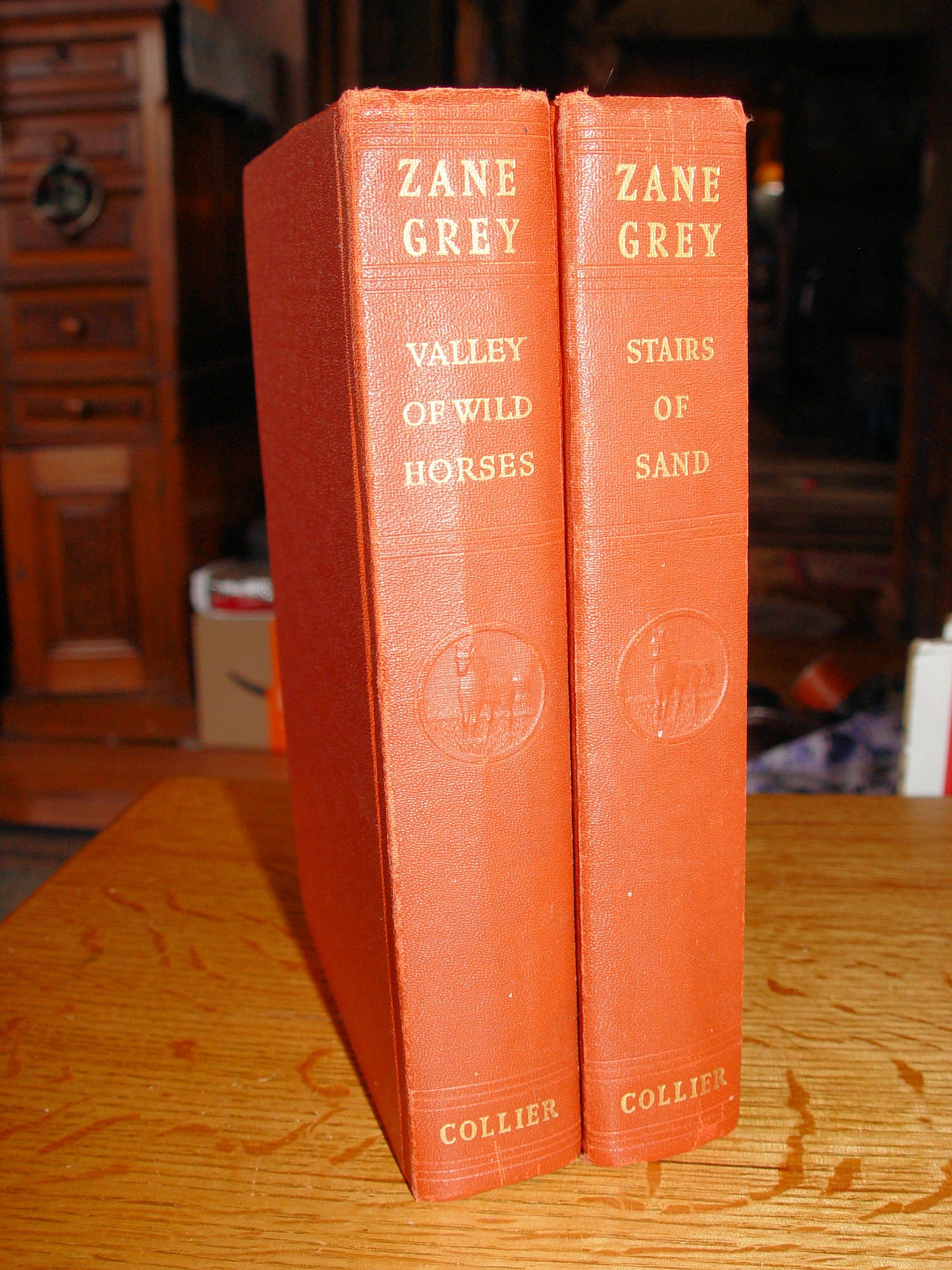 Zane Grey Western Novels - Set of Two.
                        Collier & Sons 1927 - 1928 Raised horse
                        emblem